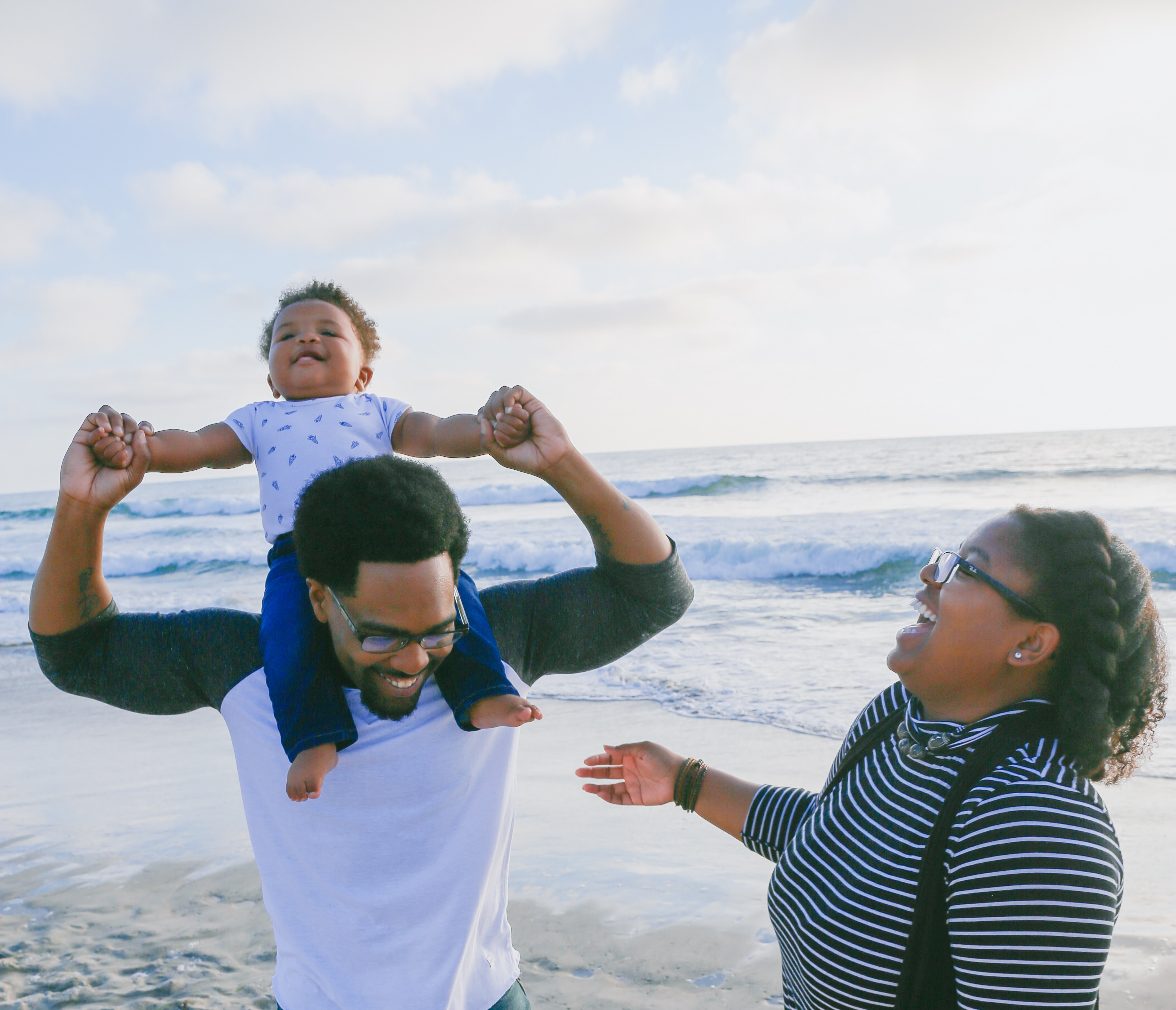 Father, mother and son at the beach.